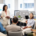 Small team of professionals attending in-person corporate AI skills training in a Singapore boardroom