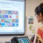 AI content creation course Singapore learner reviewing course fees on a laptop in a classroom